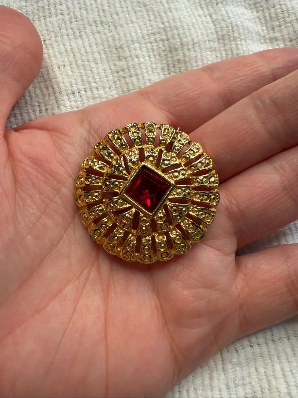 Medieval Romantic Style 1970s Goldtone Brooch with a Ruby Red Stone